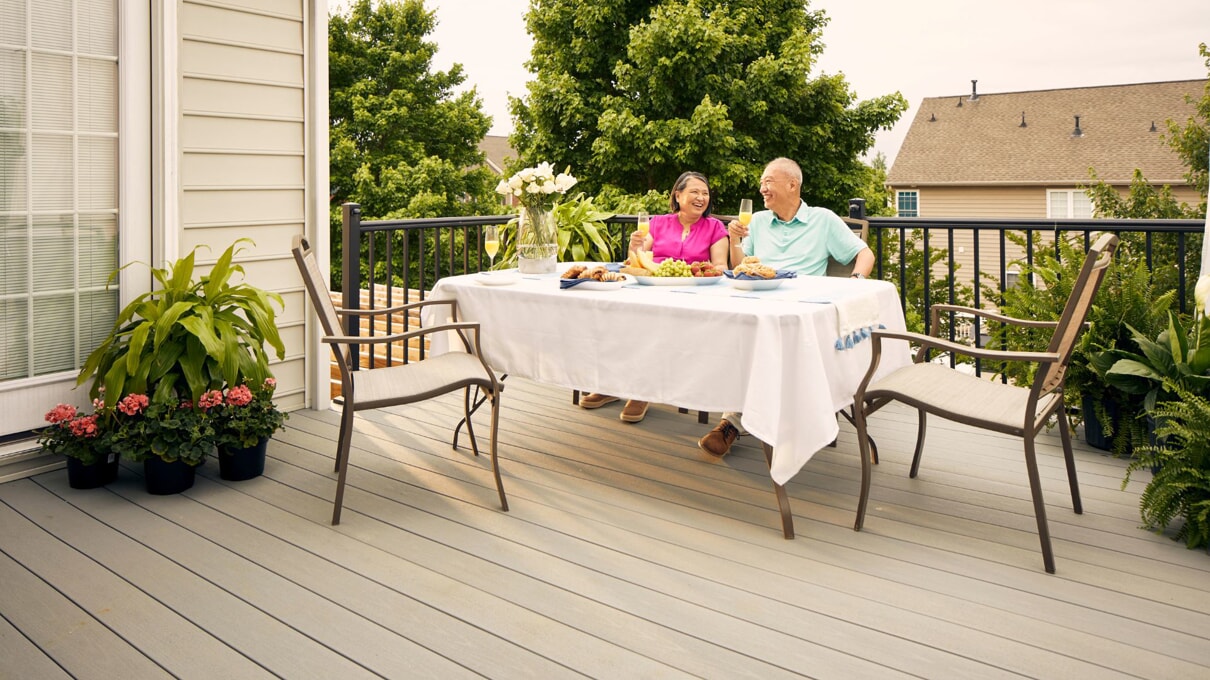 people having dinner on their deck